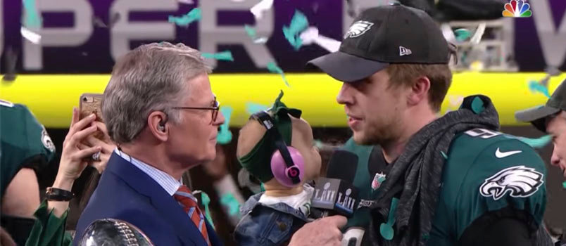 Super Bowl MVP Nick Foles holds his seven-month-old daughter Lily while being interviewed by NBC Sports' Dan Patrick after leading the Philadelphia Eagles to a 41-33 win over New England in Super Bowl LII. Screen grab from NFL/YouTube