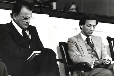 Billy Graham enjoyed mentoring young evangelists like Jerry Drace, shown on the platform with the famed evangelist.  DRACE ARCHIVES/Special