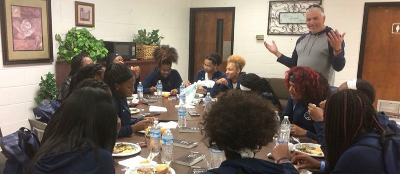 Mike Gable, minister of family life at McDonough Road Baptist Church, talks with the Lovejoy High School girls basketball team. MRBC/Special