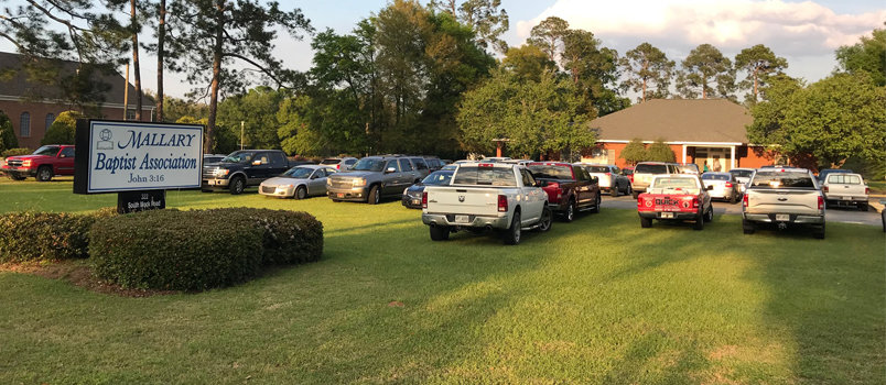 Cars overflowed the parking lot at Mallary Association the night of April 3 as Executive Committee members reluctantly arrived to address the issue between the two congregations.  JOE WESTBURY/Index