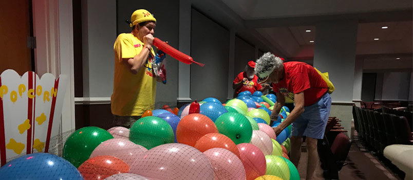 Kornpop, his legal first name, helps inflate 1,500 balloons for a benefit performance at the new Forsyth Performing Arts Center on Thursday evening.  JOE WESTBURY/Index