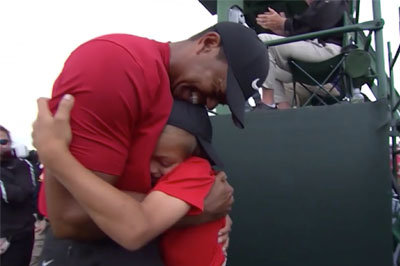 2019 Masters champion Tiger Woods is welcomed off the 18th green by his 10-year-old son, Charlie. CBSSPORTS.COM/Screen grab