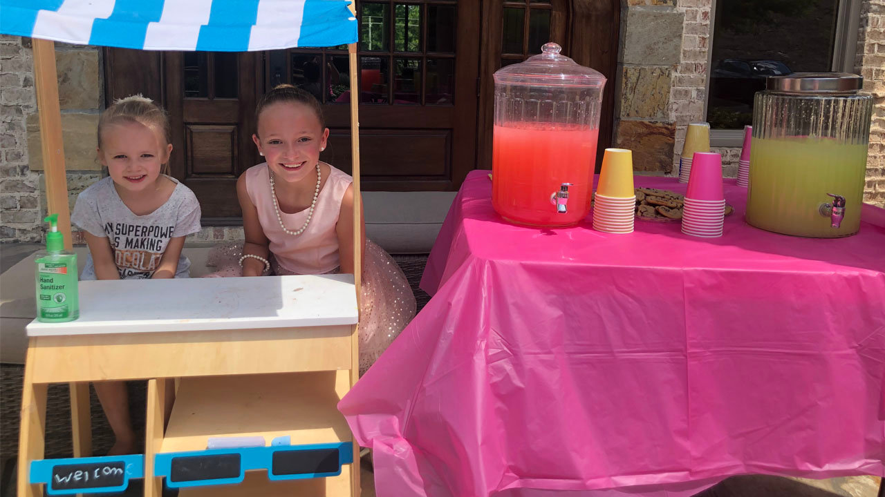Eight-year-old Arlington Blanton, right, and her sister, Ansley, left, sold lemonade as a way to raise funds for children at Emerson Elementary School in Bartow County. The girls, who attend another school in the county, are members of Emerson First Baptist Church, where Chris Wheldon is pastor and their father, David, serves as connections pastor. DAVID BLANTON/Special