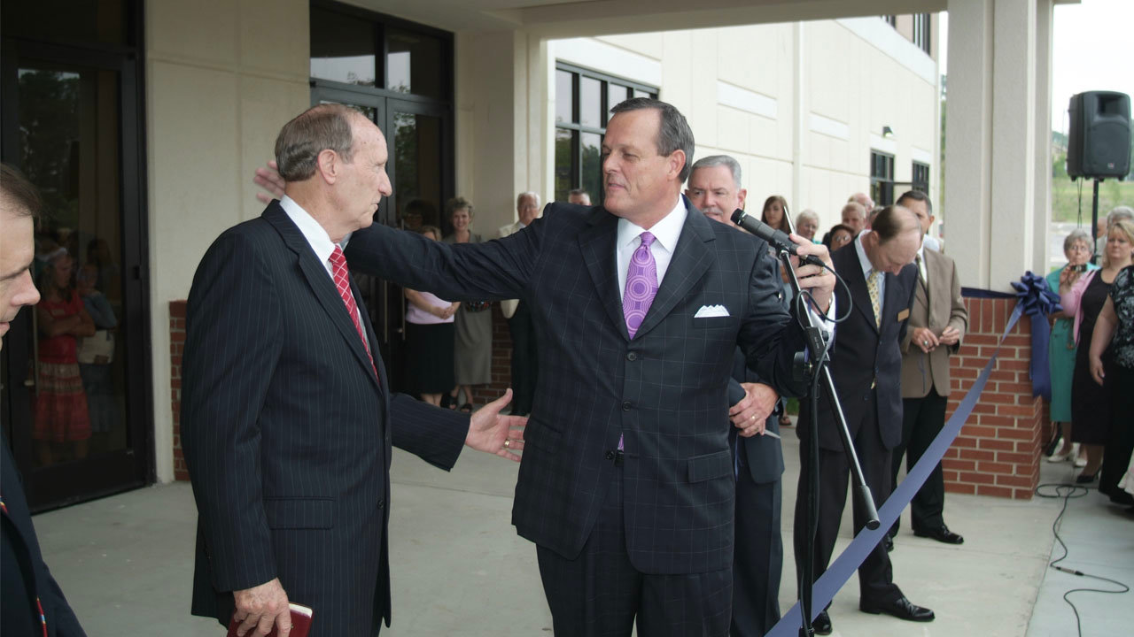 Frank Cox, right, senior pastor of North Metro Baptist Church in Lawrenceville, welcomes evangelist Bill Stafford during a ribbon-cutting ceremony for the church's new worship center in 2006. Cox and other pastors expressed their thanks to the ministry of Stafford, who died Sept. 15. NORTH METRO/Special