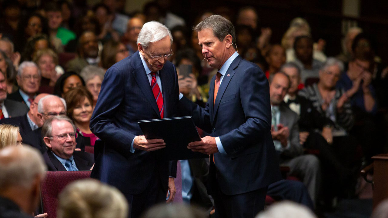 Georgia Governor Brian Kemp presents Charles Stanley with the official proclamation for Stanley "faithfully preaching the Gospel of Jesus Christ at First Baptist Atlanta, Georgia for fifty years." FBA/Special