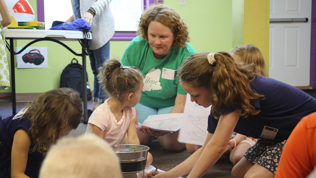 Katie Wood, who coordinates children’s ministries at Hope Church in Brunswick, Maine, helps lead a children’s activity during Sunday morning Bible study. PAM HENDERSON/WMU