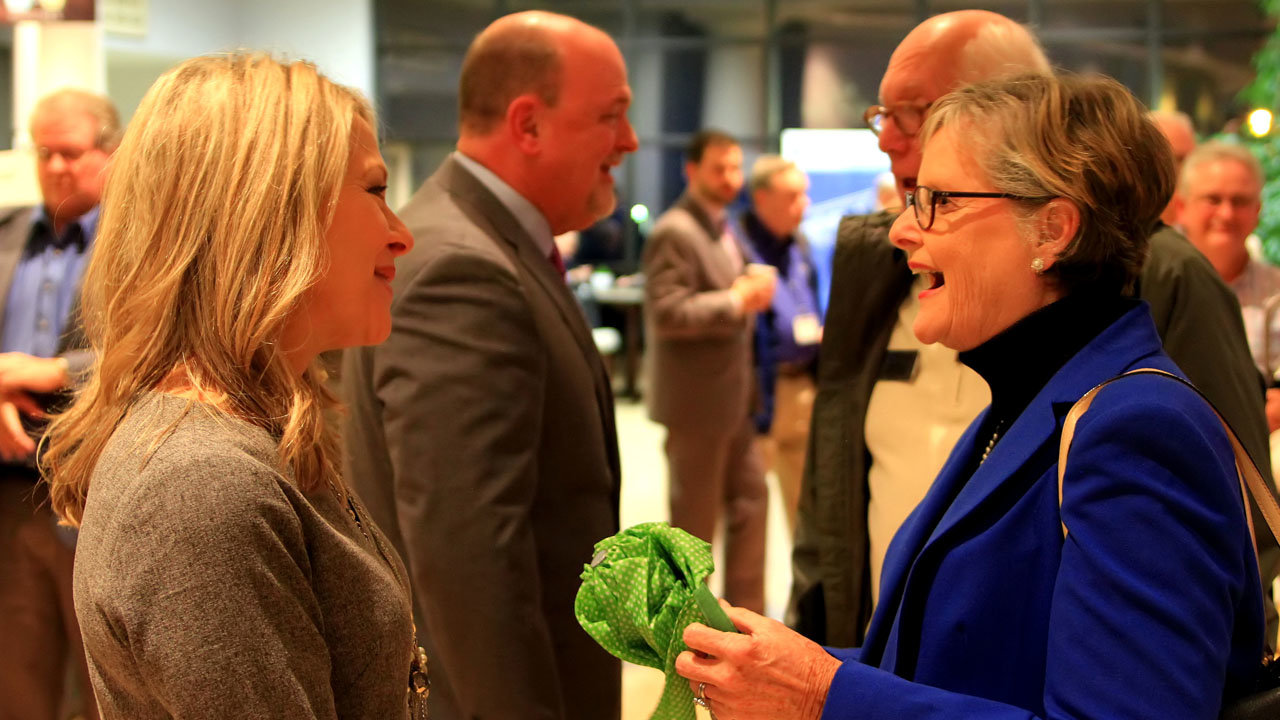 Kerri Hammond, left, talks to Phyllis Malcom at a reception during the 2018 GBC annual meeting upon her husband Thomas' being named Georgia Baptists' new executive director. In the background Thomas Hammond talks to Harris Malcom, Phyllis' husband. SCOTT BARKLEY/Index