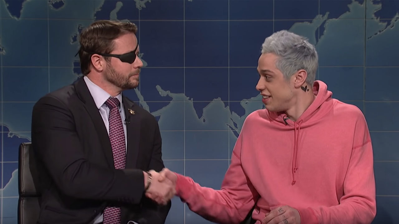 Dan Crenshaw and Pete Davidson shake hands at the conclusion of their appearance together on Saturday Night Live in 2018. YouTube screen grab/SNL