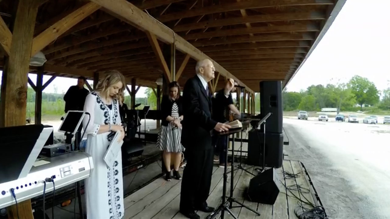 Native Georgian and legendary Southern Baptist pastor Jerry Vines brings the invitation alongside praise band members of Dry Valley Baptist Church on the grounds of Summerville Trade Day. Vines preached the Easter message at the gathering organized through Chattooga Baptist Association.