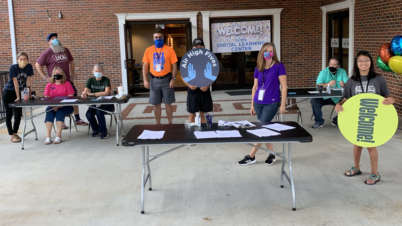 Volunteers and staff at Hebron Church in Dacula welcome students to the digital learning center, which was established shortly after local schools announced a delayed return to in-person instruction. HEBRON/Special