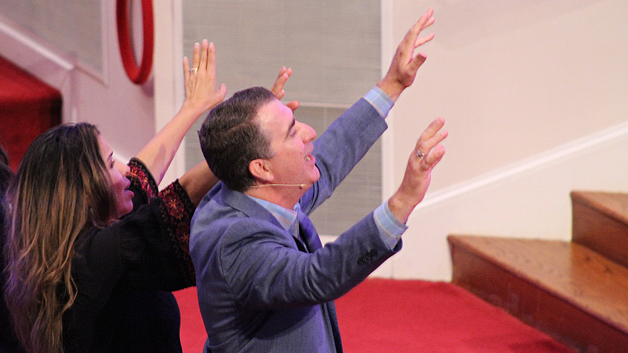 Pastor Michael and Liliana Lewis worshipping at Roswell Street Baptist Church in Marietta. MYRIAH SNYDER/Index