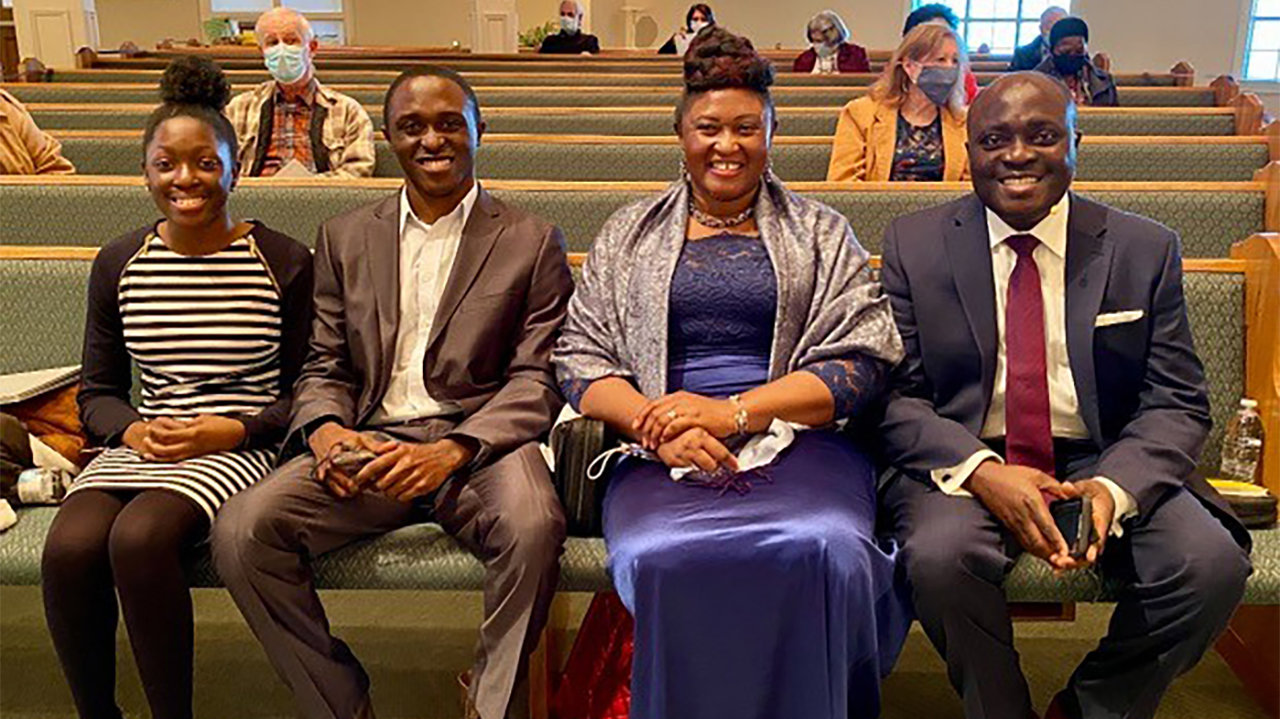 Pastor Emmanuel Ofori-Atta sits with his wife Rebecca, son Samuel, 21, and daughter Emmanuella, 14, prior to his ordination service Jan. 17.