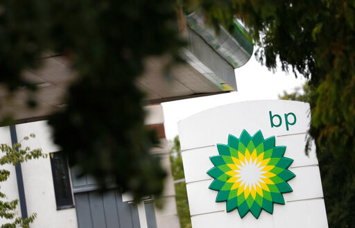 FILE - The logo of British Petroleum, BP, adorns a petrol station in west London, Aug. 4, 2020. Soaring oil and gas prices tied to the global economic recovery from the coronavirus pandemic helped bolster British oil giant BP's third-quarter profits, the company said Tuesday Nov. 2, 2021 (AP Photo/Alastair Grant, File)