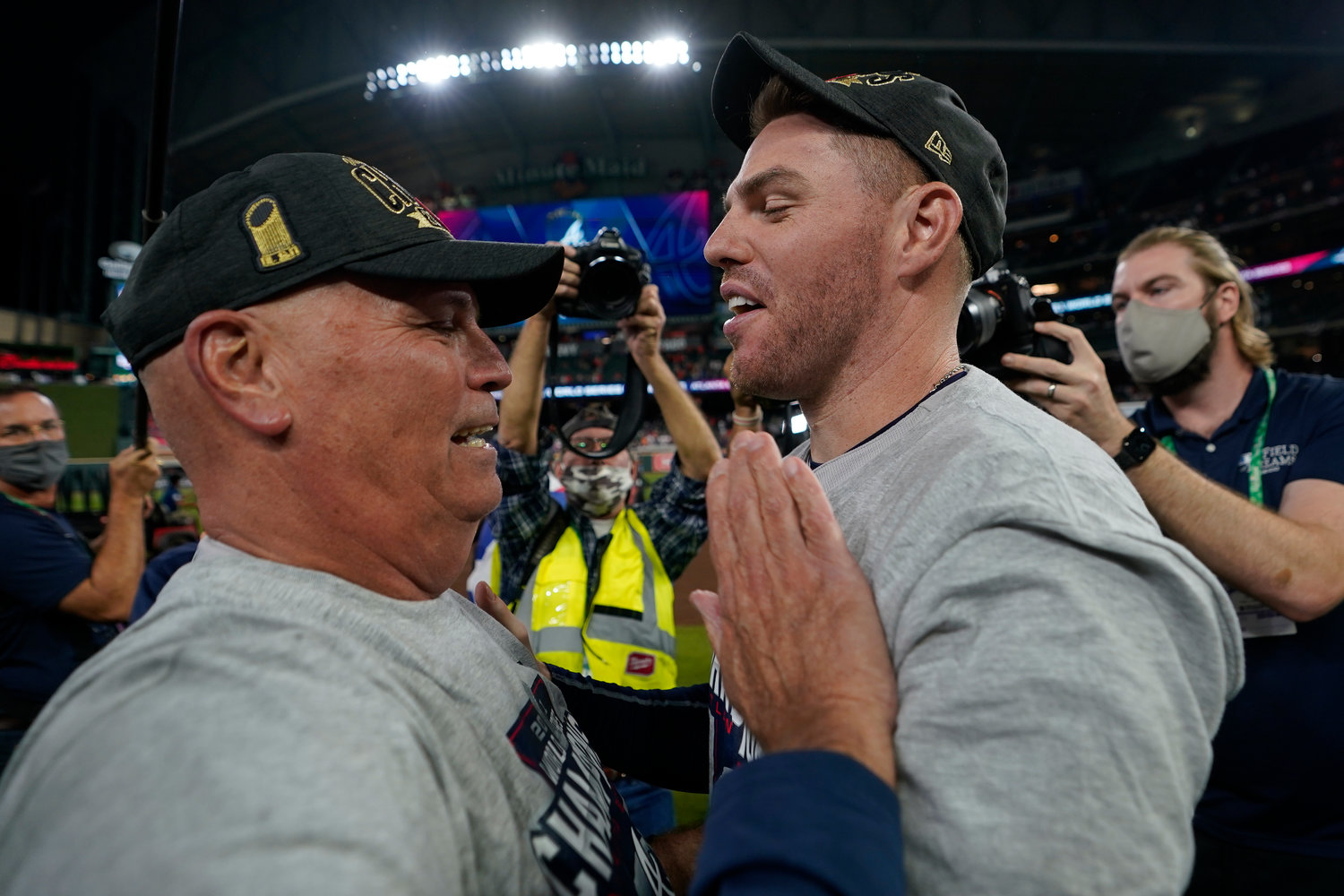 Atlanta Braves manager Brian Snitker and first baseman Freddie Freeman celebrate after winning baseball’s World Series in Game 6 against the Houston Astros Tuesday, Nov. 2, 2021, in Houston. The Braves won 7-0. (AP Photo/David J. Phillip)