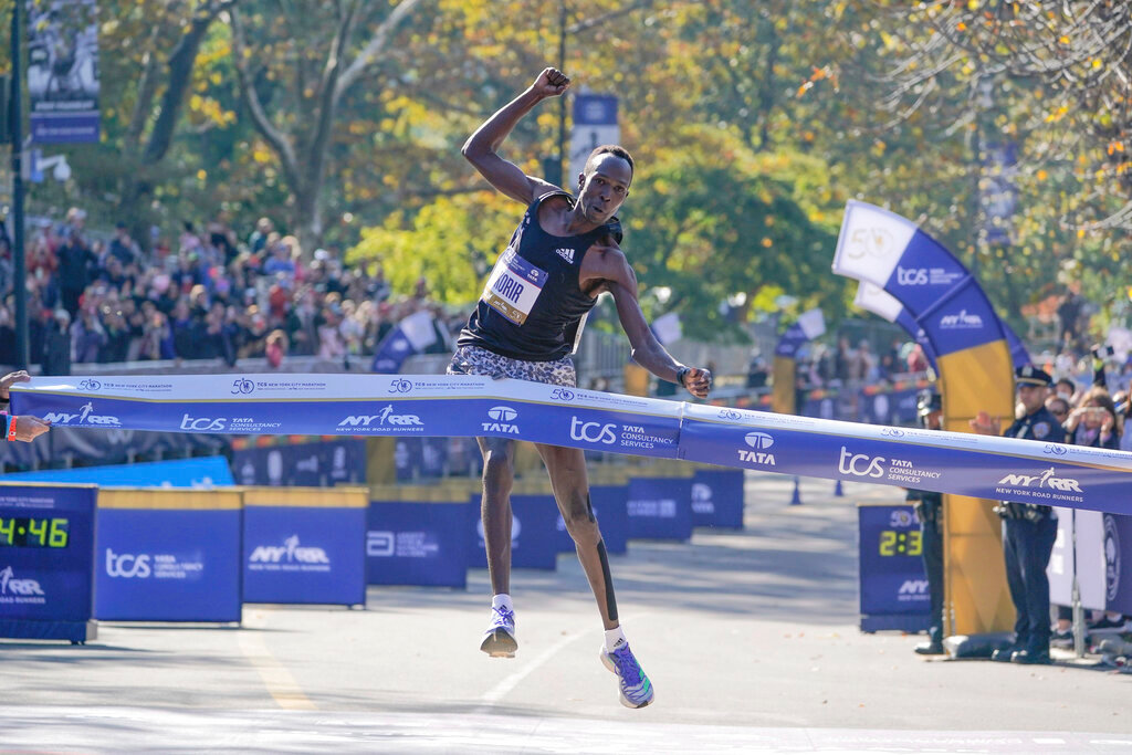 Albert Korir of Kenya crosses the finish line first in the men’s division of the New York City Marathon in New York, Sunday, Nov. 7, 2021. (AP Photo/Seth Wenig)