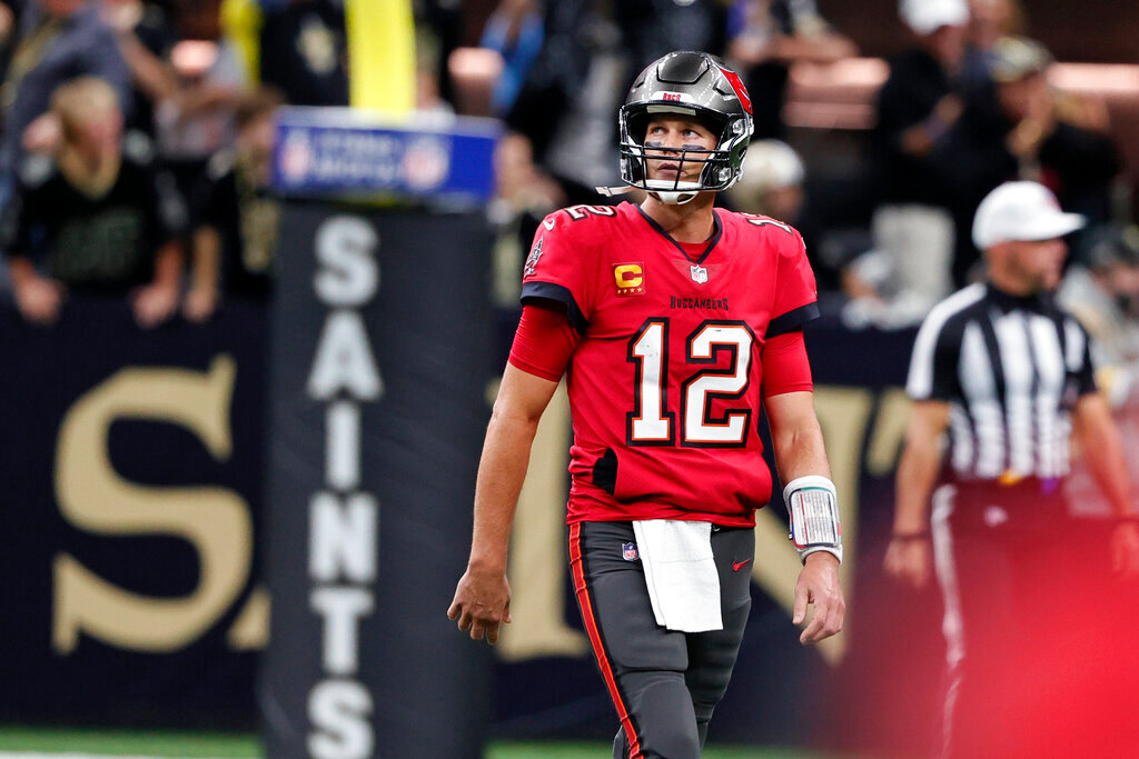 Tampa Bay Buccaneers quarterback Tom Brady (12) reacts after throwing an interception in the second half of an NFL football game against the New Orleans Saints in New Orleans, Sunday, Oct. 31, 2021. (AP Photo/Butch Dill)