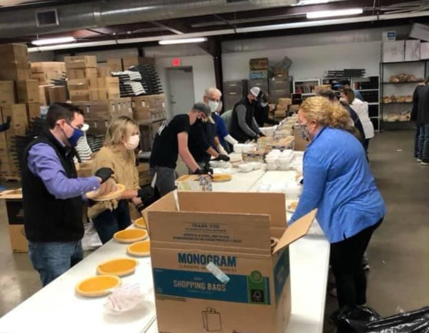 Volunteers from several churches pack food boxes for families at a recent Thanksgiving giveaway at Cornerstone Baptist Church in Dallas.