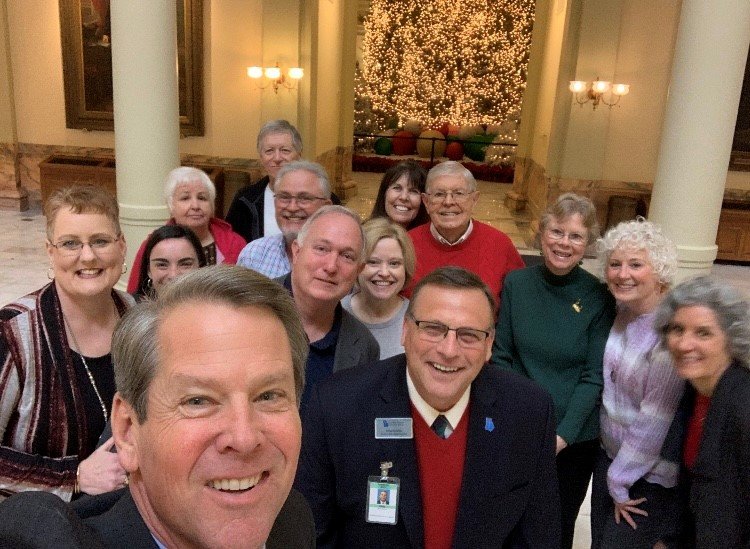 Gov. Brian Kemp shoots a selfie with a group of Georgia Baptists touring the Capitol on Wednesday.