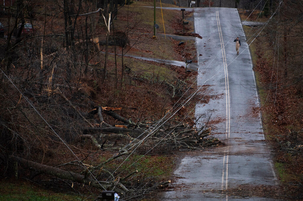 Murrell Rd. resident Keith Kruse surveys the damage from overnight storms that ripped through his community,  Saturday, Dec. 11, 2021 in Dickson Co., Tenn. Tornadoes and severe weather caused catastrophic damage across multiple states late Friday. (George Walker IV /The Tennessean via AP)