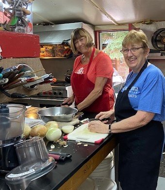Ladies from Christ Place Church prepare dinner during their trip to Wyoming. (Photo/Randy Hines)