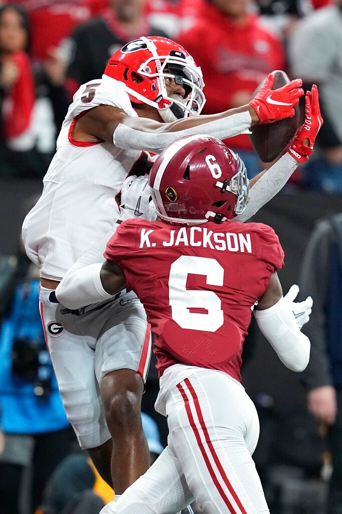 Georgia's Adonai Mitchel catches a touchdown pass over Alabama's Khyree Jackson during the second half of the College Football Playoff championship football game Monday, Jan. 10, 2022, in Indianapolis. (AP Photo/Darron Cummings)