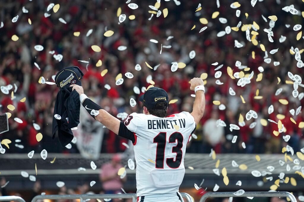 Georgia's Stetson Bennett celebrates after the College Football Playoff championship football game against Alabama Tuesday, Jan. 11, 2022, in Indianapolis. Georgia won 33-18. (AP Photo/Paul Sancya)