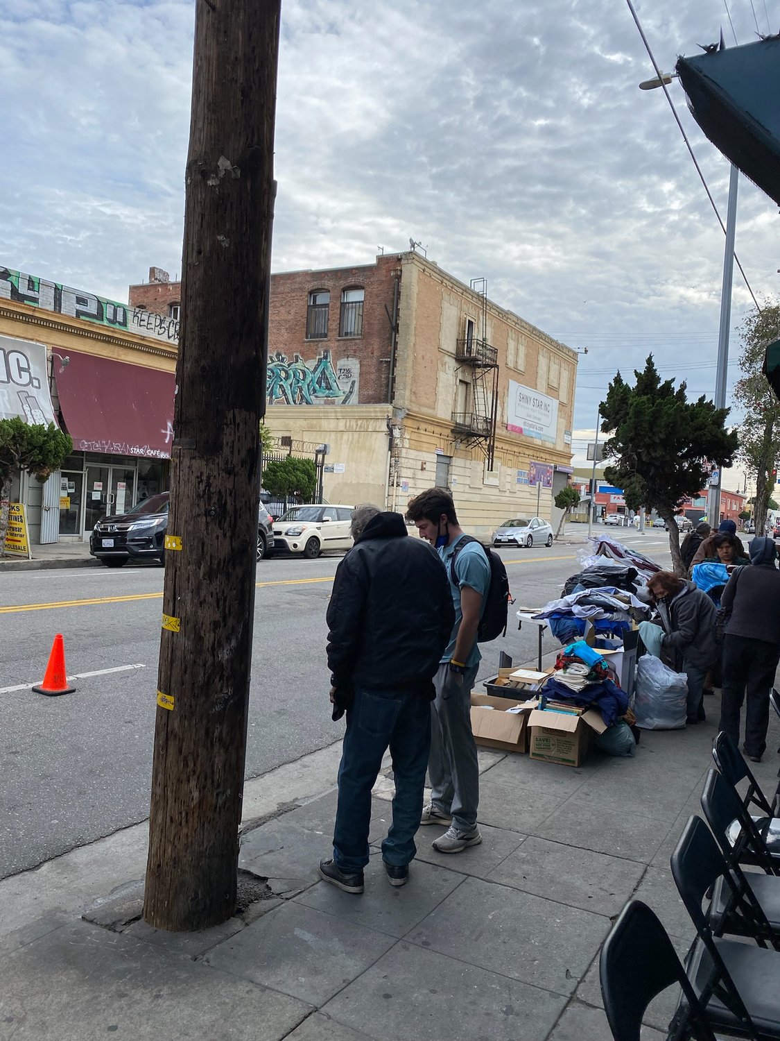 Benjamin Ryle shares the gospel with a homeless man in the Skid Row section of Los Angeles.