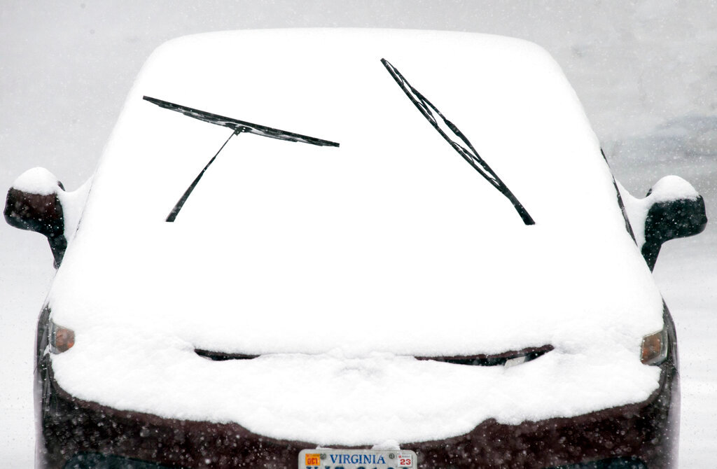 A motorist leaves wiper blades exposed in anticipation of heavy snowfall in Southwest Roanoke City on Sunday, Jan. 16, 2022, in Roanoke, Va. (AP Photo/Don Petersen)