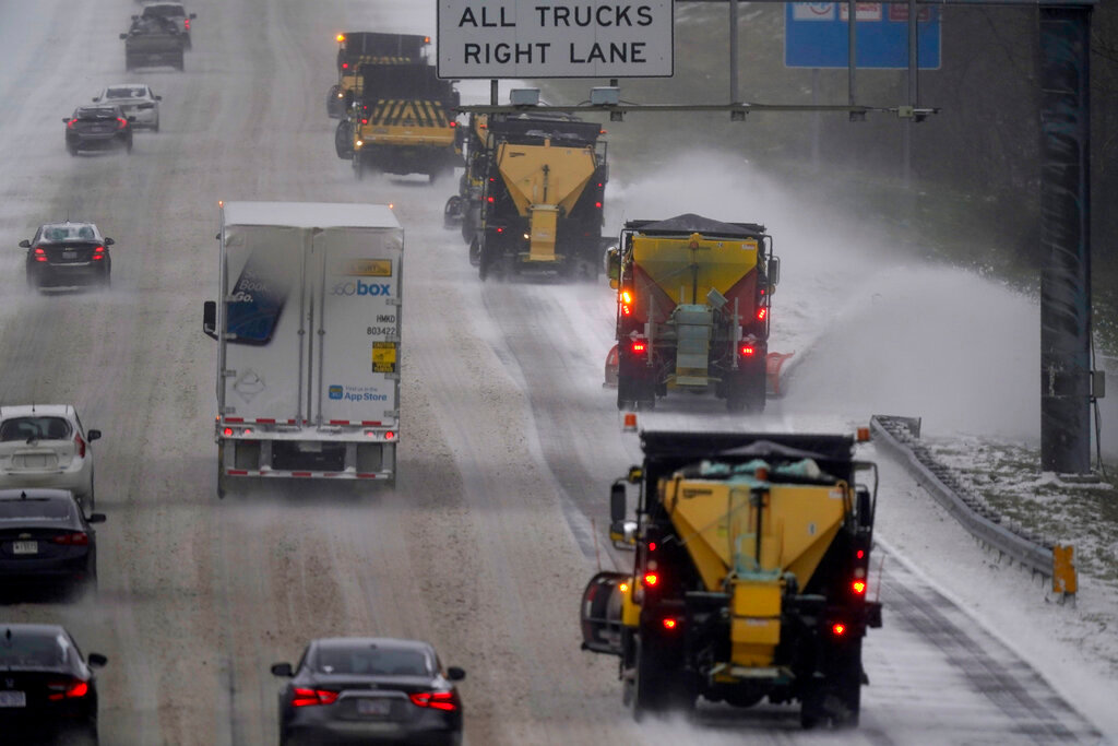 Vehicles navigate hazardous driving conditions along Interstate 85/40 as a winter storm moves through the area in Mebane, N.C., Sunday, Jan. 16, 2022. (AP Photo/Gerry Broome)