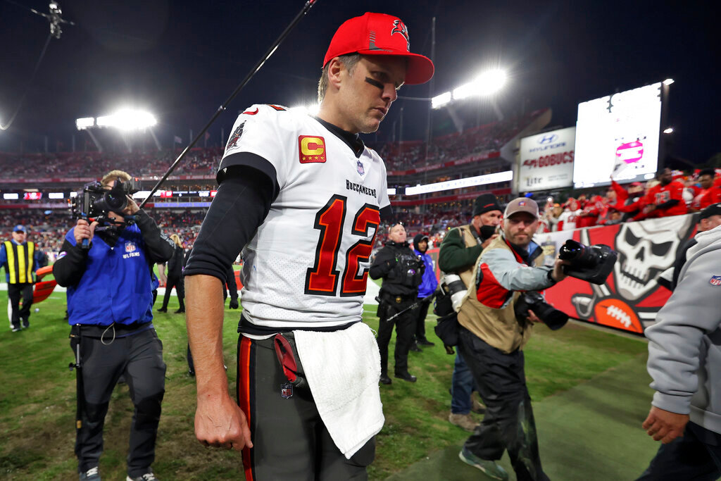 Tampa Bay Buccaneers quarterback Tom Brady (12) reacts as he leaves the field after the team lost to the Los Angeles Rams during an NFL divisional round playoff football game Sunday, Jan. 23, 2022, in Tampa, Fla. (AP Photo/Mark LoMoglio)