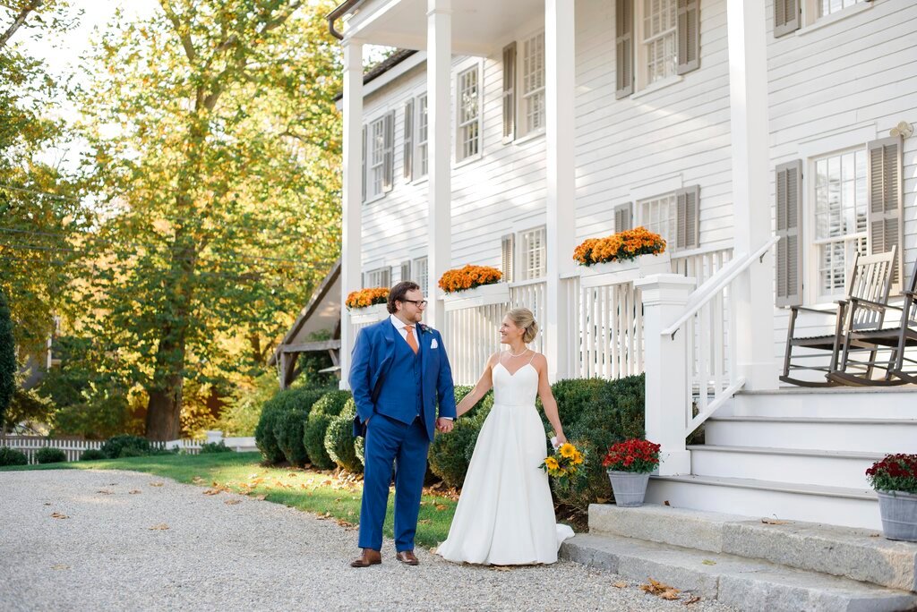 This photo shows Shelley Kapitulik-Jaye and her husband, Stephen Jaye, on Oct. 20, 2021, in Norwalk, Conn.. The two wed on a Wednesday, tapping into a trend of couples choosing weekdays for their weddings, either by choice or necessity. (Mindy Briar Photography via AP)