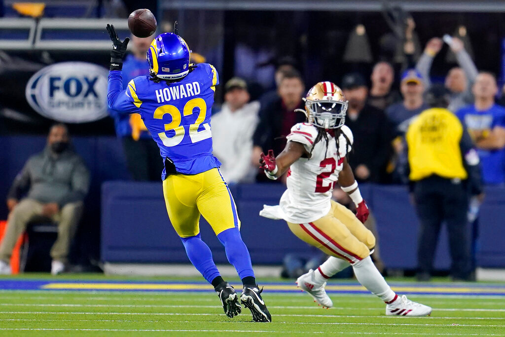 Los Angeles Rams' Travin Howard (32) intercepts a pass in front of San Francisco 49ers' JaMycal Hasty during the second half of the NFC Championship NFL football game Sunday, Jan. 30, 2022, in Inglewood, Calif. (AP Photo/Marcio Jose Sanchez)