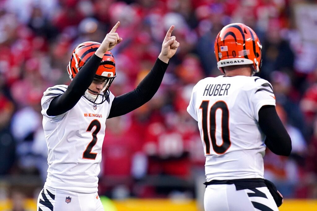 Cincinnati Bengals kicker Evan McPherson (2) celebrates with  Kevin Huber (10) after kicking a 52-yard field goal during the second half of the AFC championship NFL football game against the Kansas City Chiefs, Sunday, Jan. 30, 2022, in Kansas City, Mo. (AP Photo/Eric Gay)