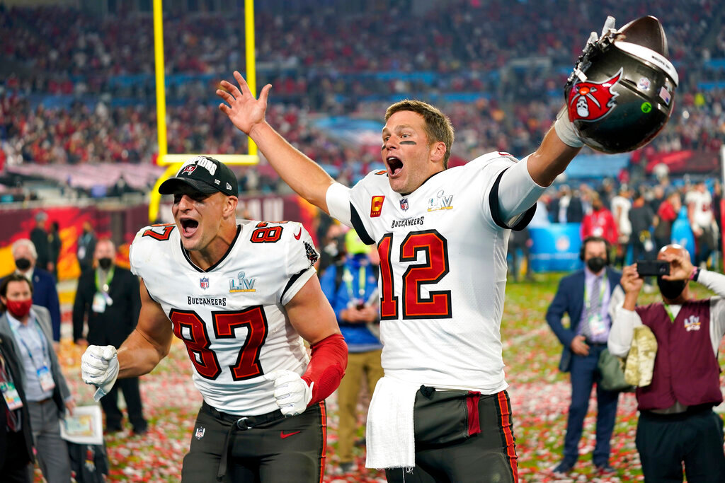 Tampa Bay Buccaneers tight end Rob Gronkowski, left, and quarterback Tom Brady (12) celebrate after the NFL Super Bowl 55 football game against the Kansas City Chiefs in Tampa, Fla., Feb. 7, 2021. Tom Brady has retired after winning seven Super Bowls and setting numerous passing records in an unprecedented 22-year-career. He made the announcement, Tuesday, Feb. 1, 2022, in a long post on Instagram. (AP Photo/Steve Luciano, File)