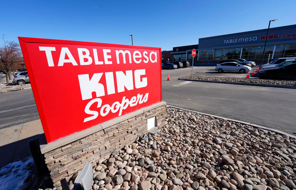 The new sign stands outside the Table Mesa King Soopers during a media tour Tuesday, Feb. 8, 2022, in Boulder, Colo. Ten people were killed inside and outside the store, which reopens to the public Wednesday, Feb. 9, when a gunman opened fire on shoppers in the store on Monday, March 22, 2021. (AP Photo/David Zalubowski)..............