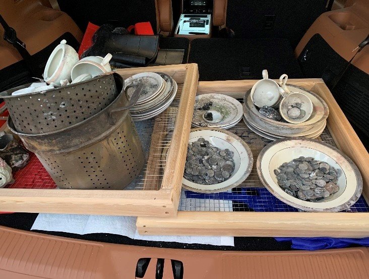 Some of the dishes and coins that Disaster Relief workers have been able to retrieve. (Photo/Colorado Baptist Disaster Relief)