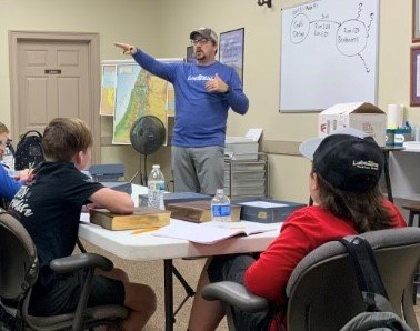 Students discuss the Bible at a learning center in northeast Georgia. Last week, 17 students made professions of faith.