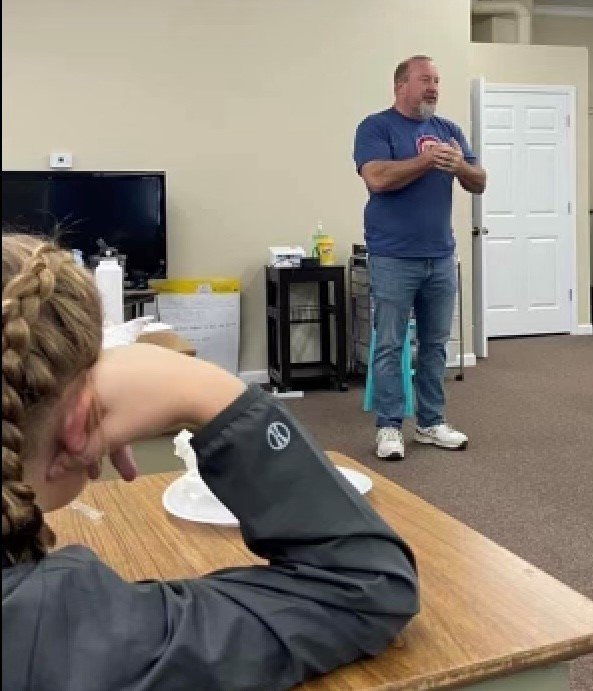 Toccoa evangelist Steve Paysen shares the gospel with students at a learning center in northeast Georgia.
