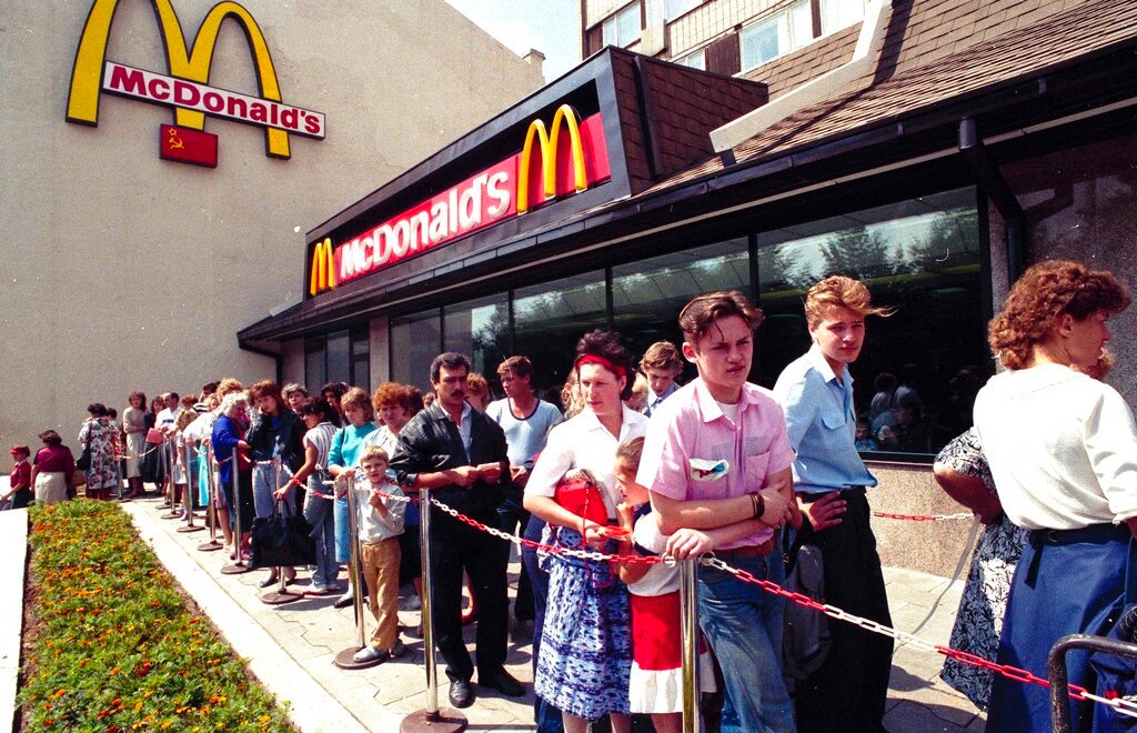 Russians wait in line outside a McDonald's fast food restaurant in Moscow in 1991. Two months after the Berlin Wall fell, another powerful symbol opened its doors in the middle of Moscow: a gleaming new McDonald’s. It was the first American fast-food restaurant to enter the Soviet Union. But now, McDonald's is temporarily closing its 850 restaurants in Russia in response to the Ukraine invasion. (AP Photo/File)