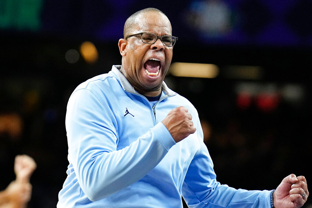 North Carolina head coach Hubert Davis reacts to a play during the first half of a college basketball game against Duke in the semifinal round of the Men's Final Four NCAA tournament, Saturday, April 2, 2022, in New Orleans. (AP Photo/Brynn Anderson)