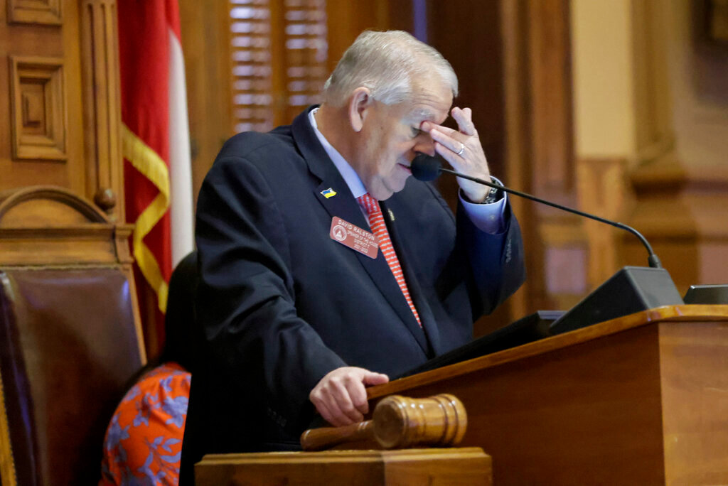 House Speaker David Ralston wipes his eyes while honoring Rep. Calvin Smyre at the Georgia State Capitol in Atlanta on Monday, April 4, 2022. After serving in the Georgia house for 48 years, Smyre, nicknamed the "Dean" of the house, was honored on his last day in the legislature on Sine Die, the last day of the General Assembly. Smyre is retiring from the Georgia House of Representatives as he prepares to serve as U.S. Ambassador to the Dominican Republic. (Bob Andres/Atlanta Journal-Constitution via AP)