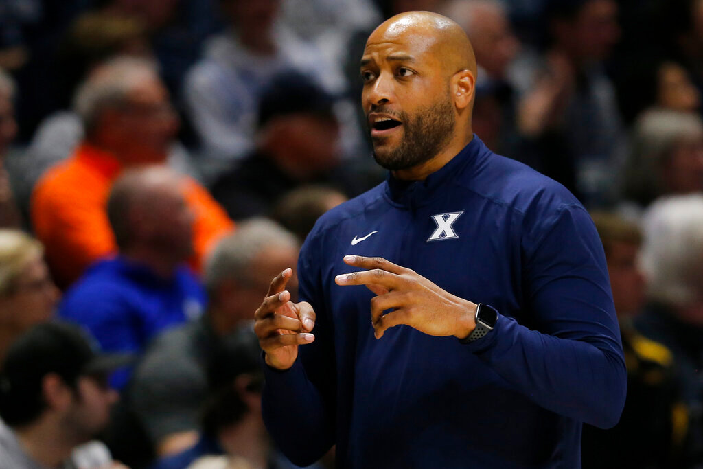 Xavier Musketeers head coach Jonas Hayes walks down the sideline in the first half of the NIT Quarter Final game between the Xavier Musketeers and the Vanderbilt Commodores at the Cintas Center in Cincinnati on Tuesday, March 22, 2022. Vanderbilt led 31-29 at halftime.