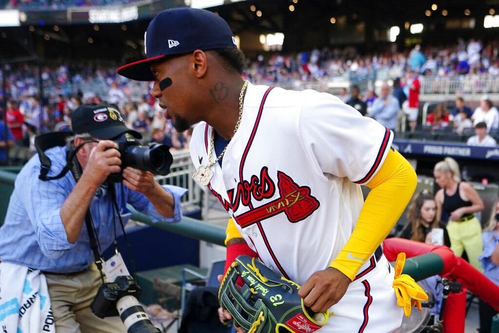 Atlanta Braves' Ronald Acuna Jr. takes the field for the team's baseball game against the Chicago Cubs on Thursday, April 28, 2022, in Atlanta. Acuna was in the lineup for the first time since a season-ending knee injury last year. (AP Photo/John Bazemore)