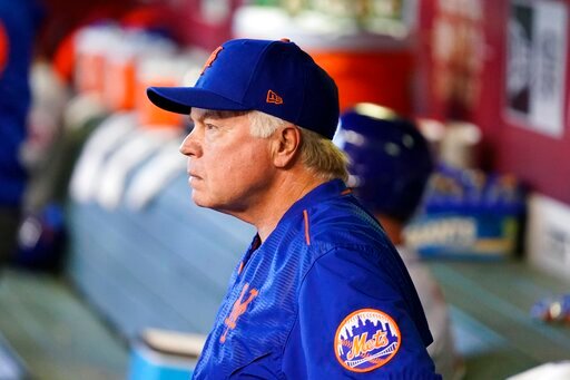 New York Mets manager Buck Showalter looks on from the dugout prior to a baseball game against the Arizona Diamondbacks, Sunday, April 24, 2022, in Phoenix. (AP Photo/Ross D. Franklin)