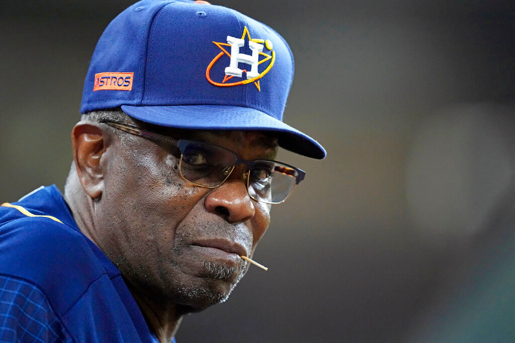 Houston Astros manager Dusty Baker Jr. watches from the dugout during the sixth inning of a baseball game against the Seattle Mariners Monday, May 2, 2022, in Houston. (AP Photo/David J. Phillip, File)