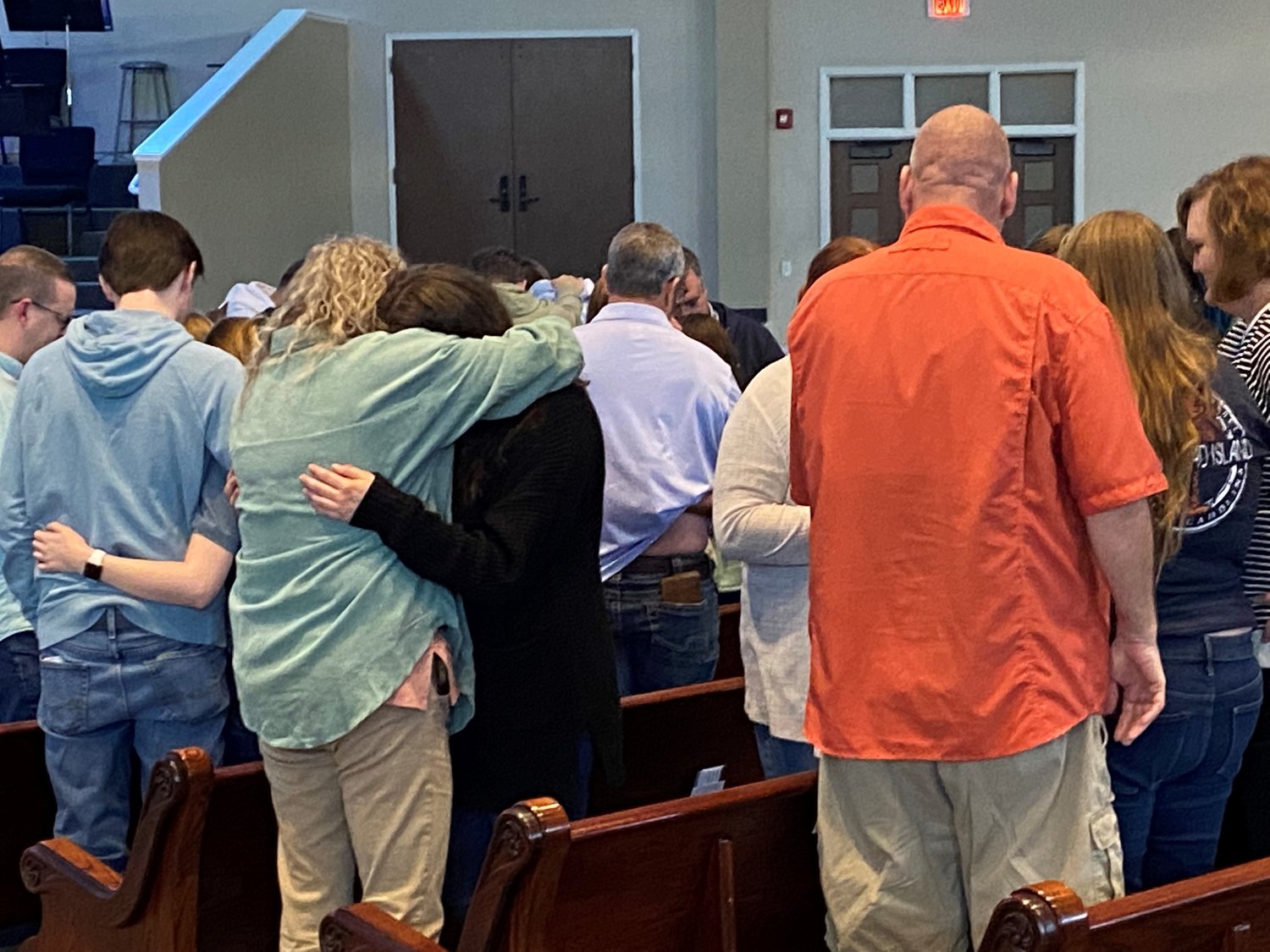 Chris Bryan, campus minister at Georgia Southern University, far left, prays with student missionaries and their families Saturday, April 9, during a commissioning service at Glen Haven Baptist Church in McDonough, Ga. (Photo/Clarissa Morrison, Georgia Baptist Mission Board)