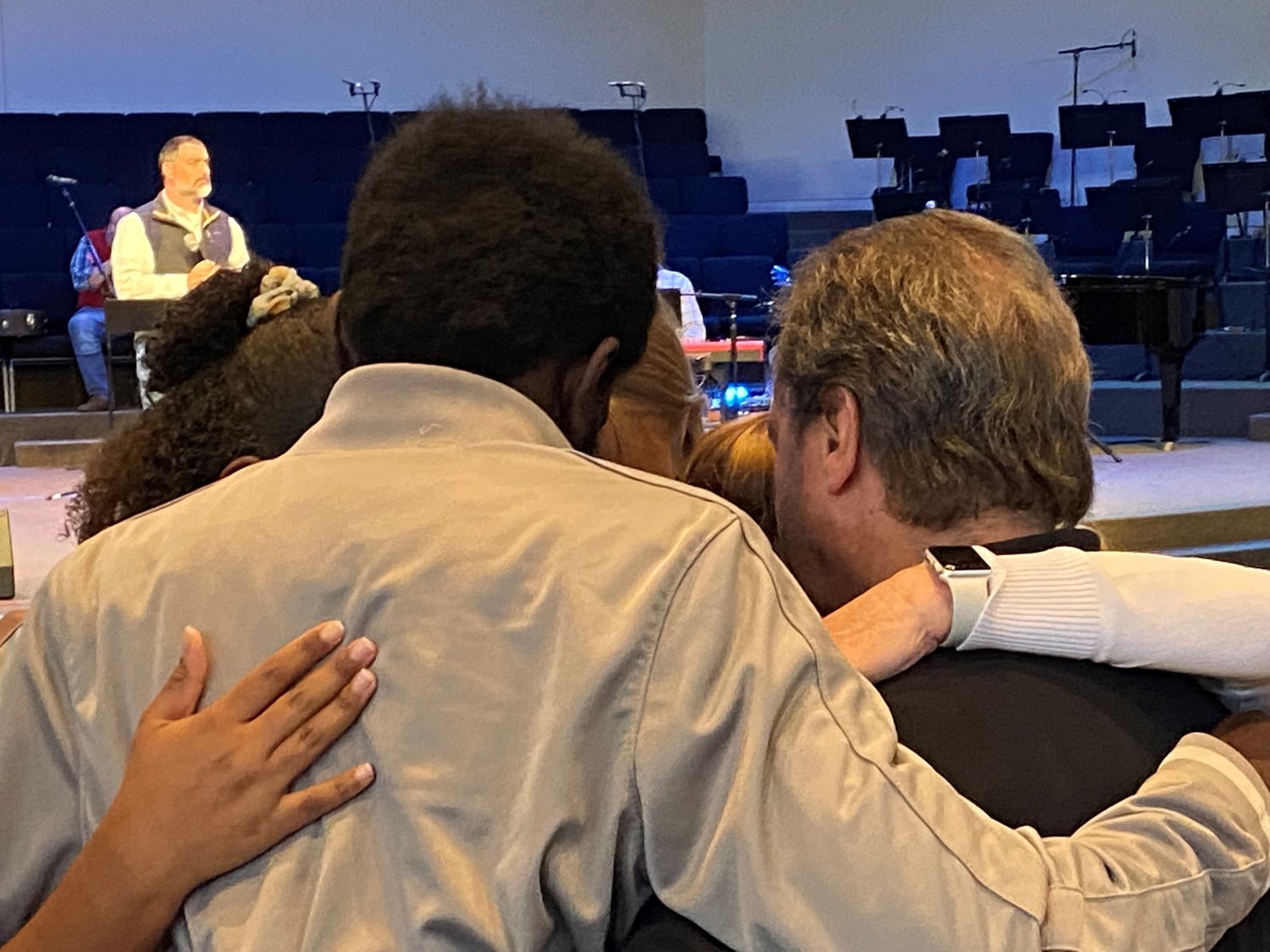 Ken Jones, campus minister at Kennesaw State University, and his wife Janet pray with student missionaries Samuel Ayeni, Alisha Philpot and Anna Poole, Saturday, April 9, during a commissioning service at Glen Haven Baptist Church in McDonough, Ga. (Photo/Clarissa Morrison, Georgia Baptist Mission Board)