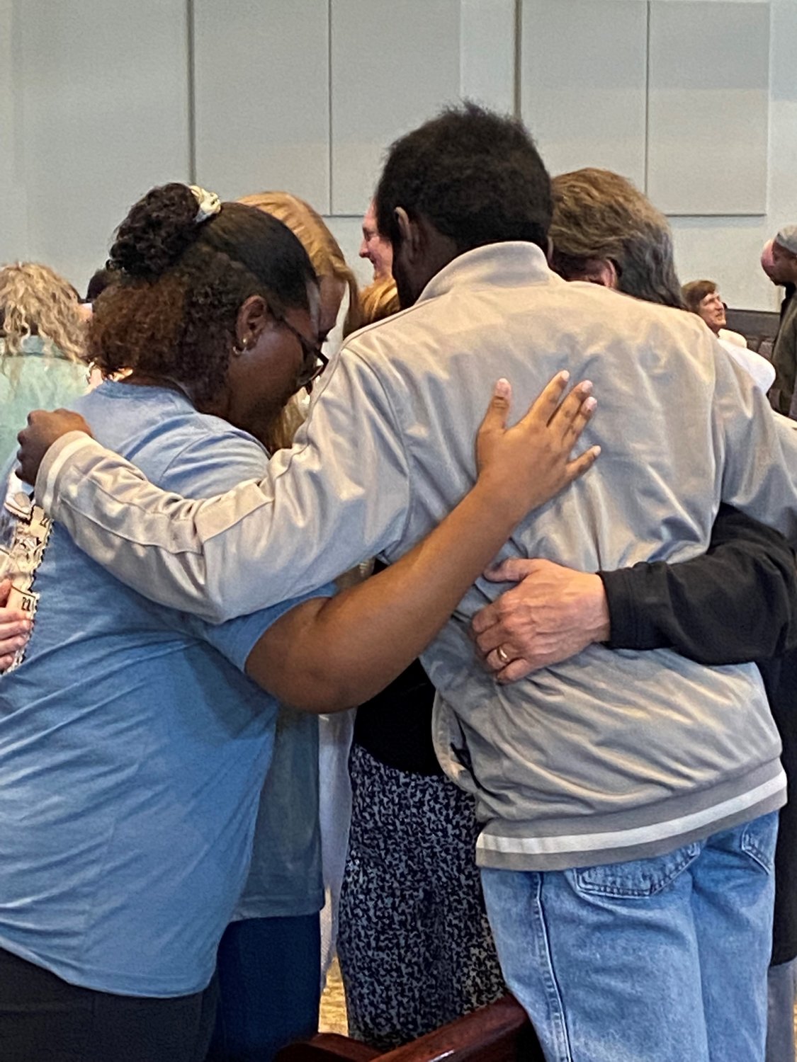 Ken Jones, campus minister at Kennesaw State University, and his wife Janet pray with student missionaries Samuel Ayeni, Alisha Philpot and Anna Poole, Saturday, April 9, during a commissioning service at Glen Haven Baptist Church in McDonough, Ga. (Photo/Clarissa Morrison, Georgia Baptist Mission Board)