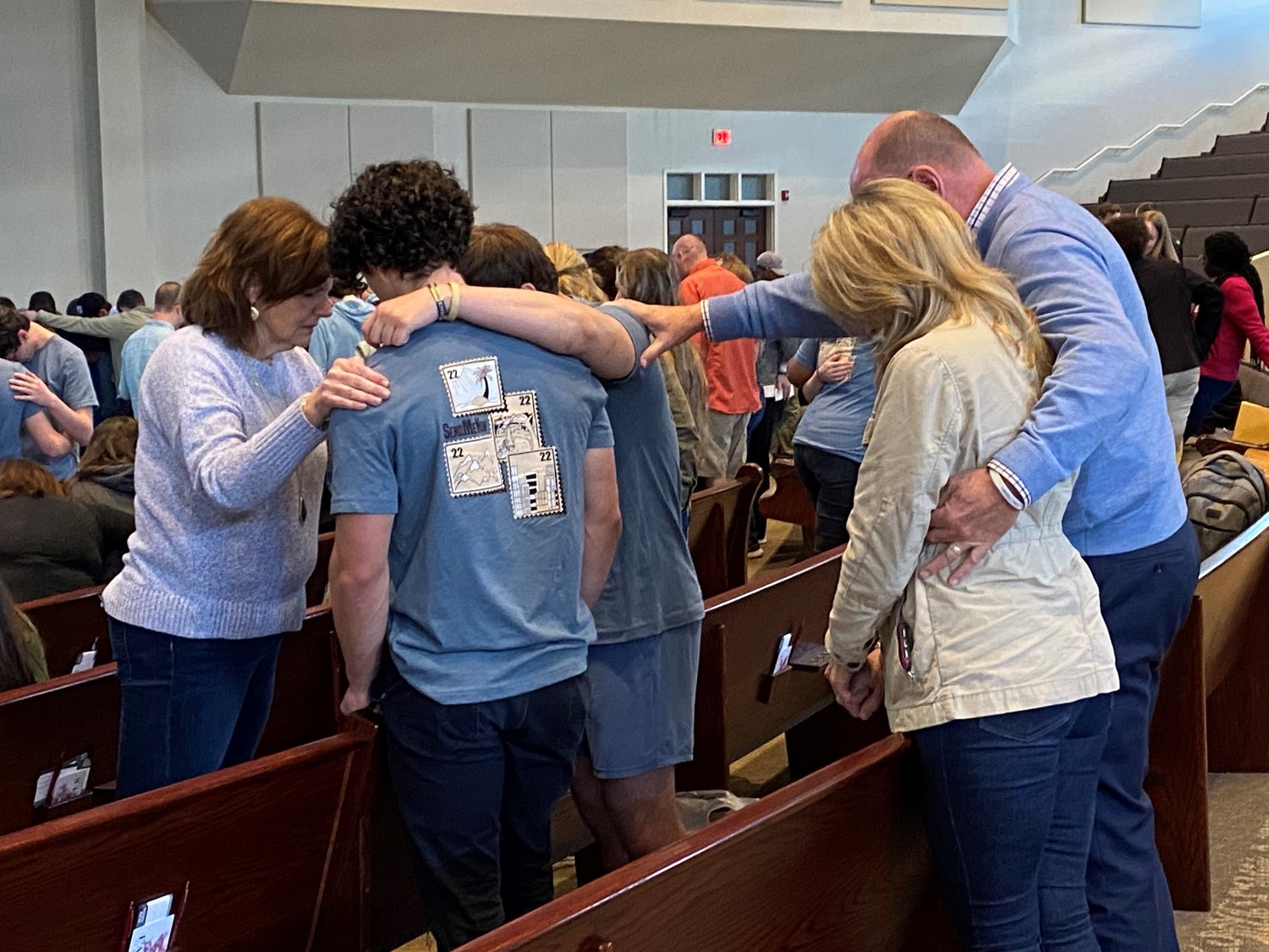 Rev. Thomas and Kerri Hammond along with Kim Harris of Noonday Baptist Association pray with student missionaries Josiah Cuneo and Corey Rotolo, both from Georgia State University, Saturday, April 9, during a commissioning service at Glen Haven Baptist Church in McDonough, Ga. (Photo/Clarissa Morrison, Georgia Baptist Mission Board)