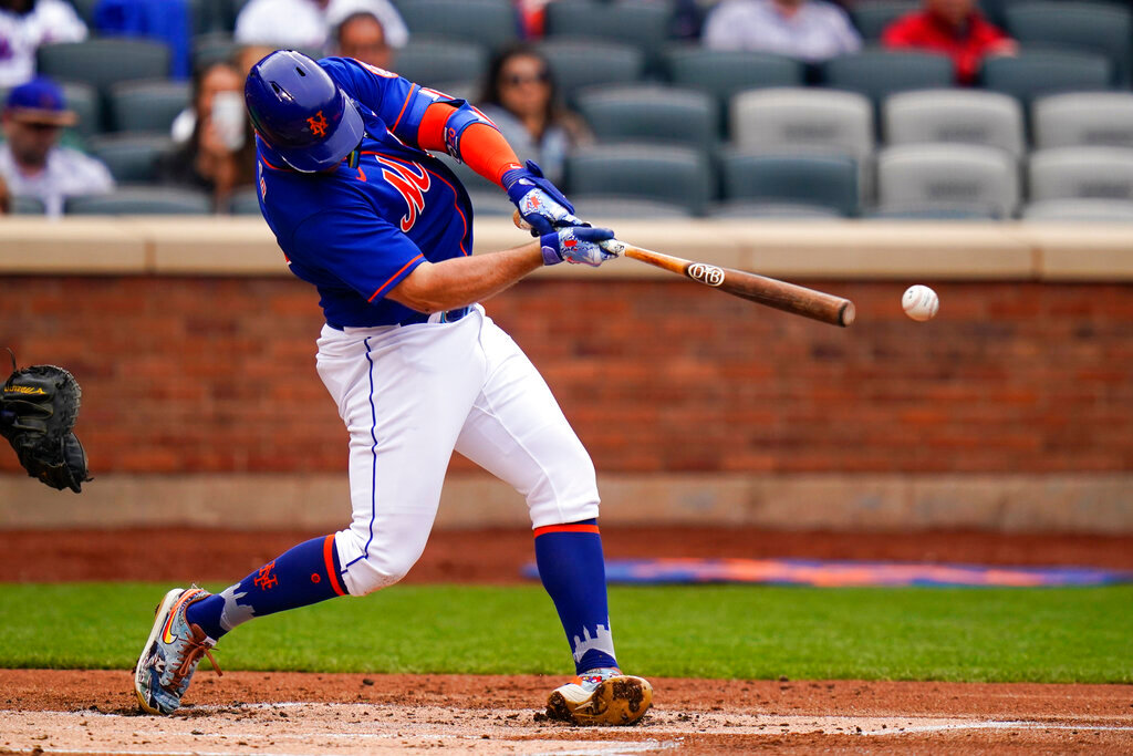New York Mets' Pete Alonso hits an RBI single against the Atlanta Braves in the first game of a doubleheader, Tuesday, May 3, 2022, in New York. (AP Photo/Frank Franklin II)